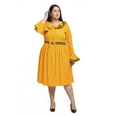 Yellow crepe knee-length fit and flare dress with full sleeves, ideal for formal occasions